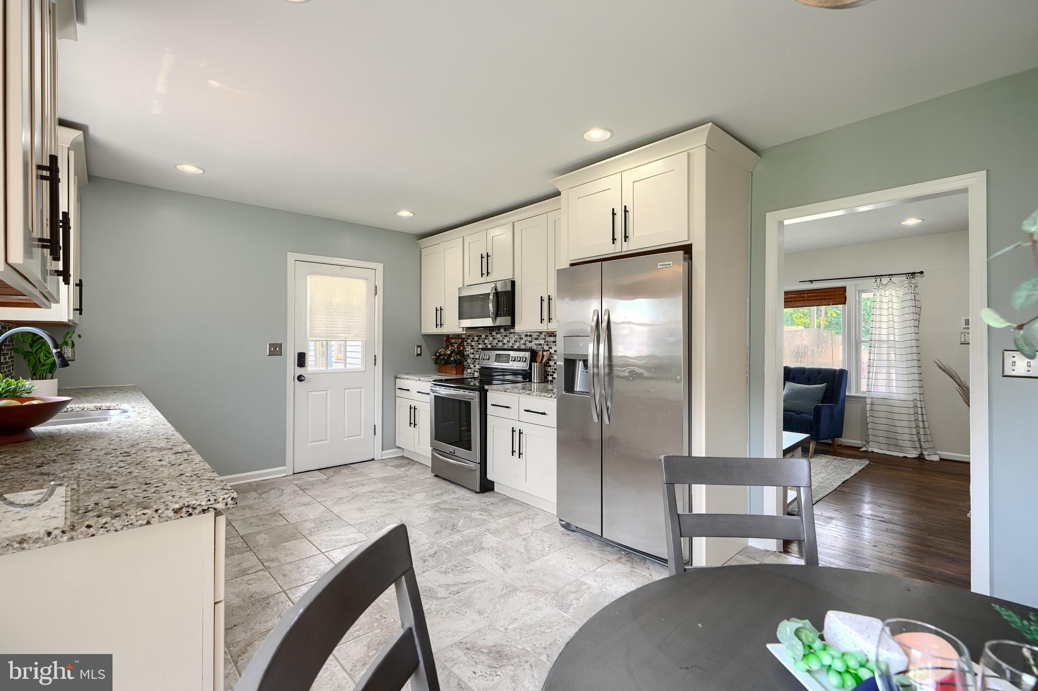 2903 Sparrows Point Road Sparrows Point, MD 21219 - Photo 13 of 57 a kitchen with stainless steel appliances granite countertop a refrigerator a stove and a sink