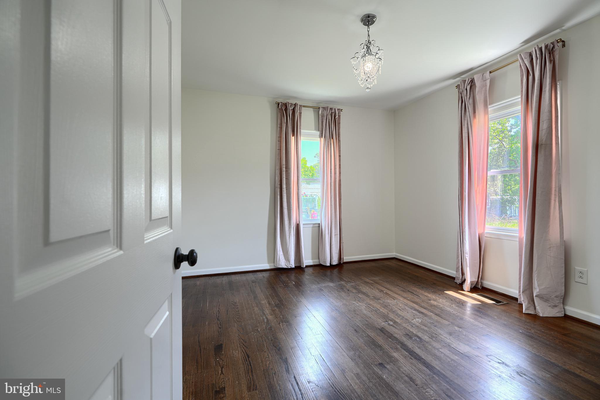 2903 Sparrows Point Road Sparrows Point, MD 21219 - Photo 25 of 57 an empty room with wooden floor and windows