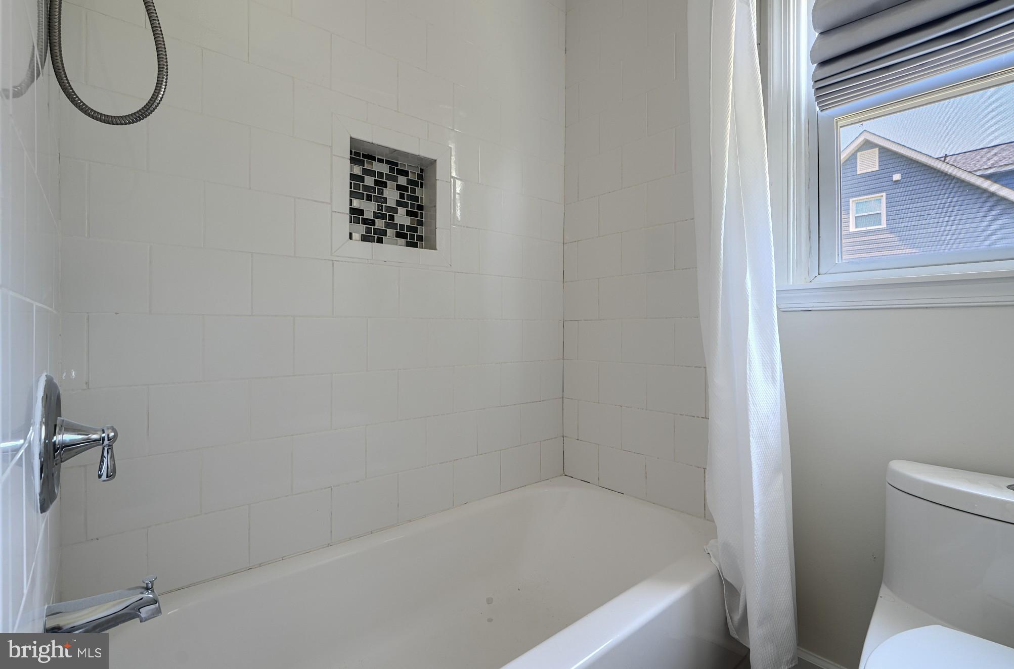 2903 Sparrows Point Road Sparrows Point, MD 21219 - Photo 32 of 57 a bathroom with a bath tub and a shower