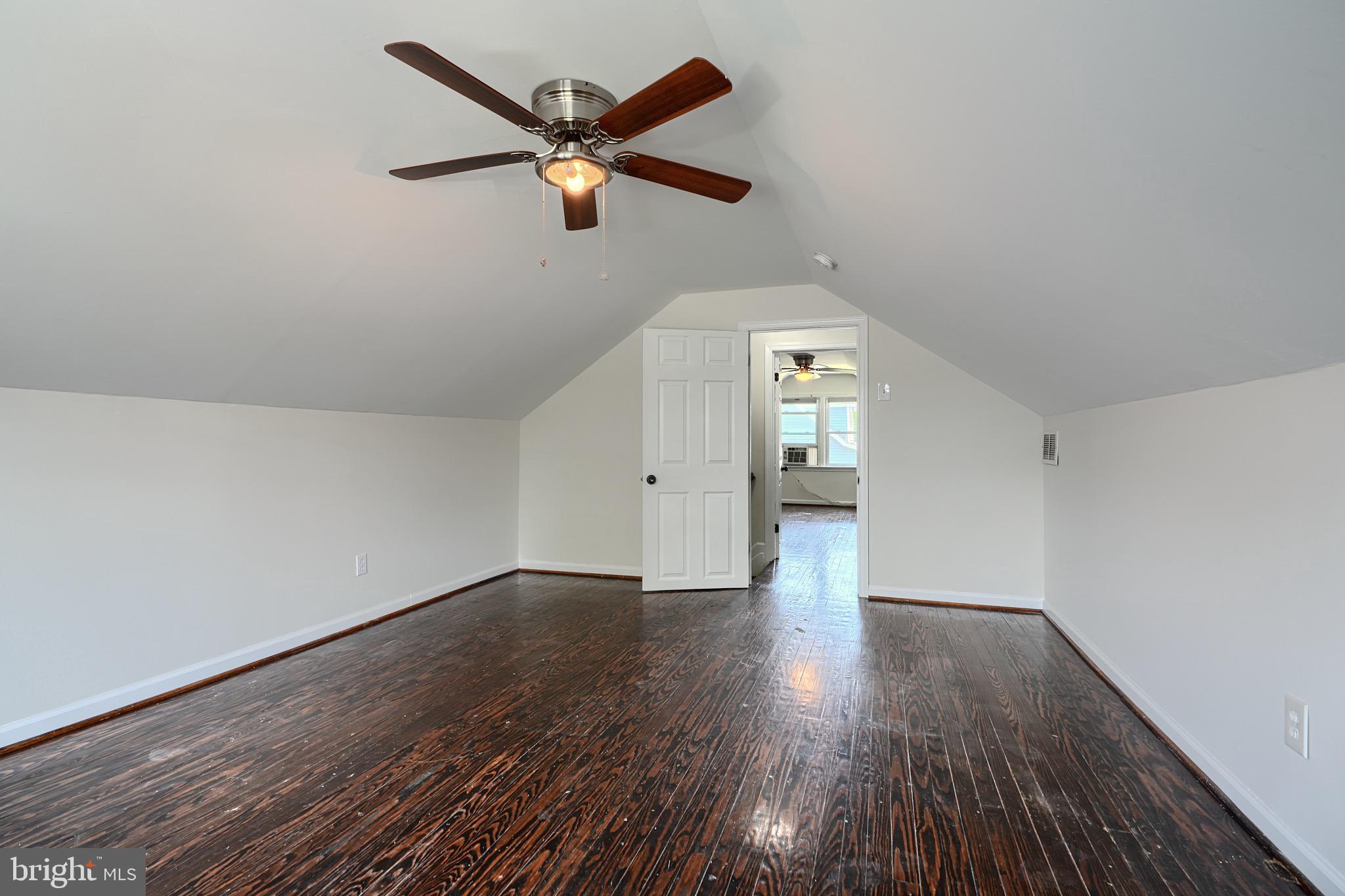 2903 Sparrows Point Road Sparrows Point, MD 21219 - Photo 34 of 57 wooden floor in an empty room with a window