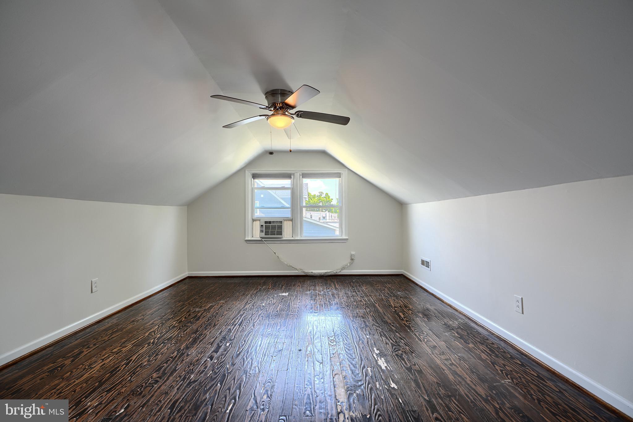 2903 Sparrows Point Road Sparrows Point, MD 21219 - Photo 35 of 57 an empty room with wooden floor and windows