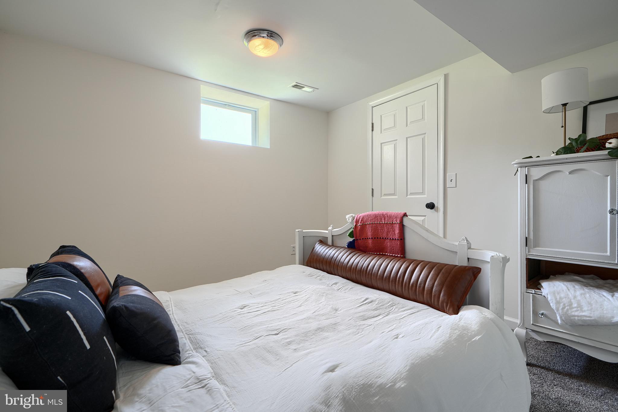 2903 Sparrows Point Road Sparrows Point, MD 21219 - Photo 42 of 57 a bedroom with a bed and a couch