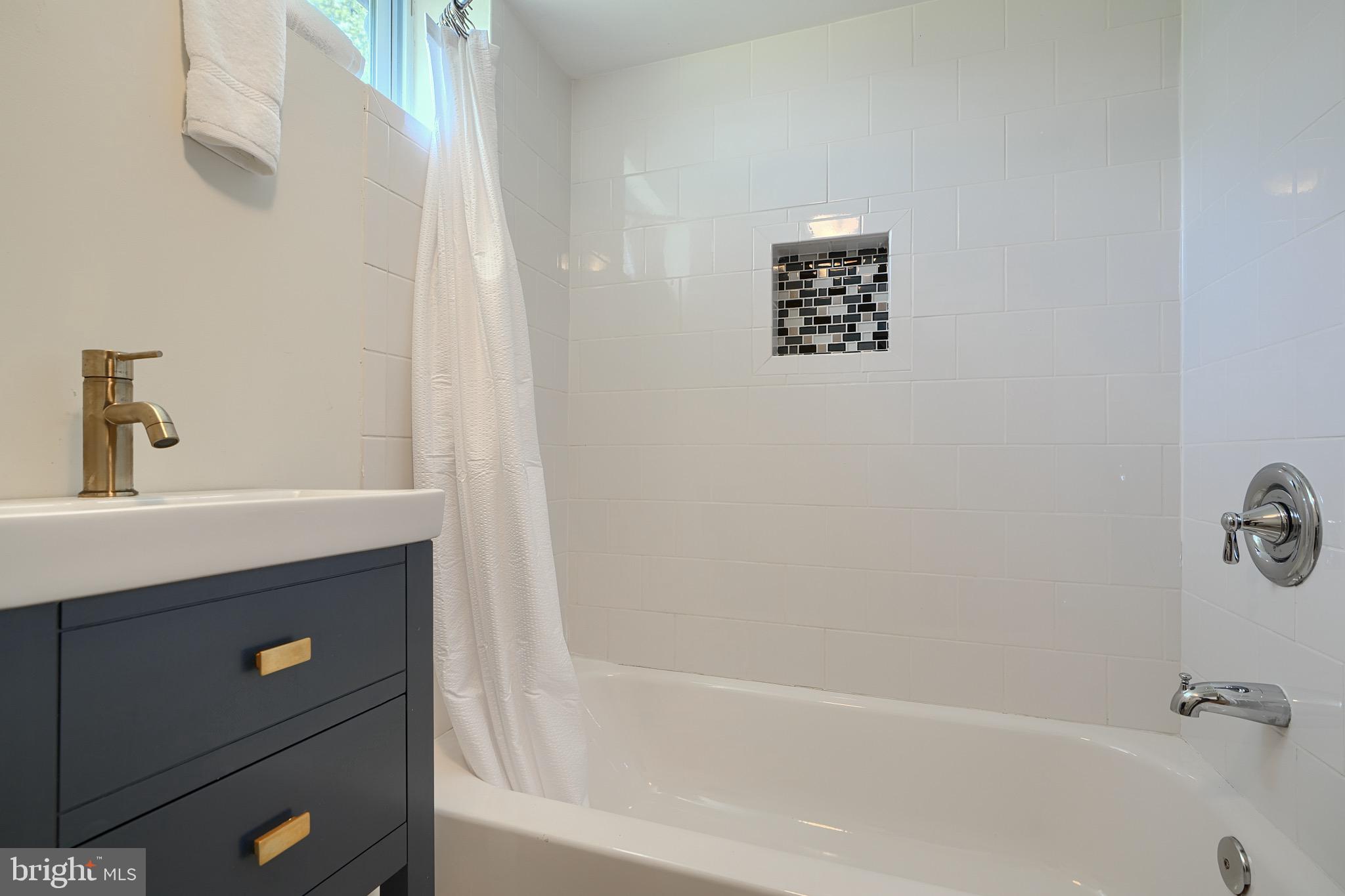2903 Sparrows Point Road Sparrows Point, MD 21219 - Photo 48 of 57 a bathroom with a bathtub and a sink