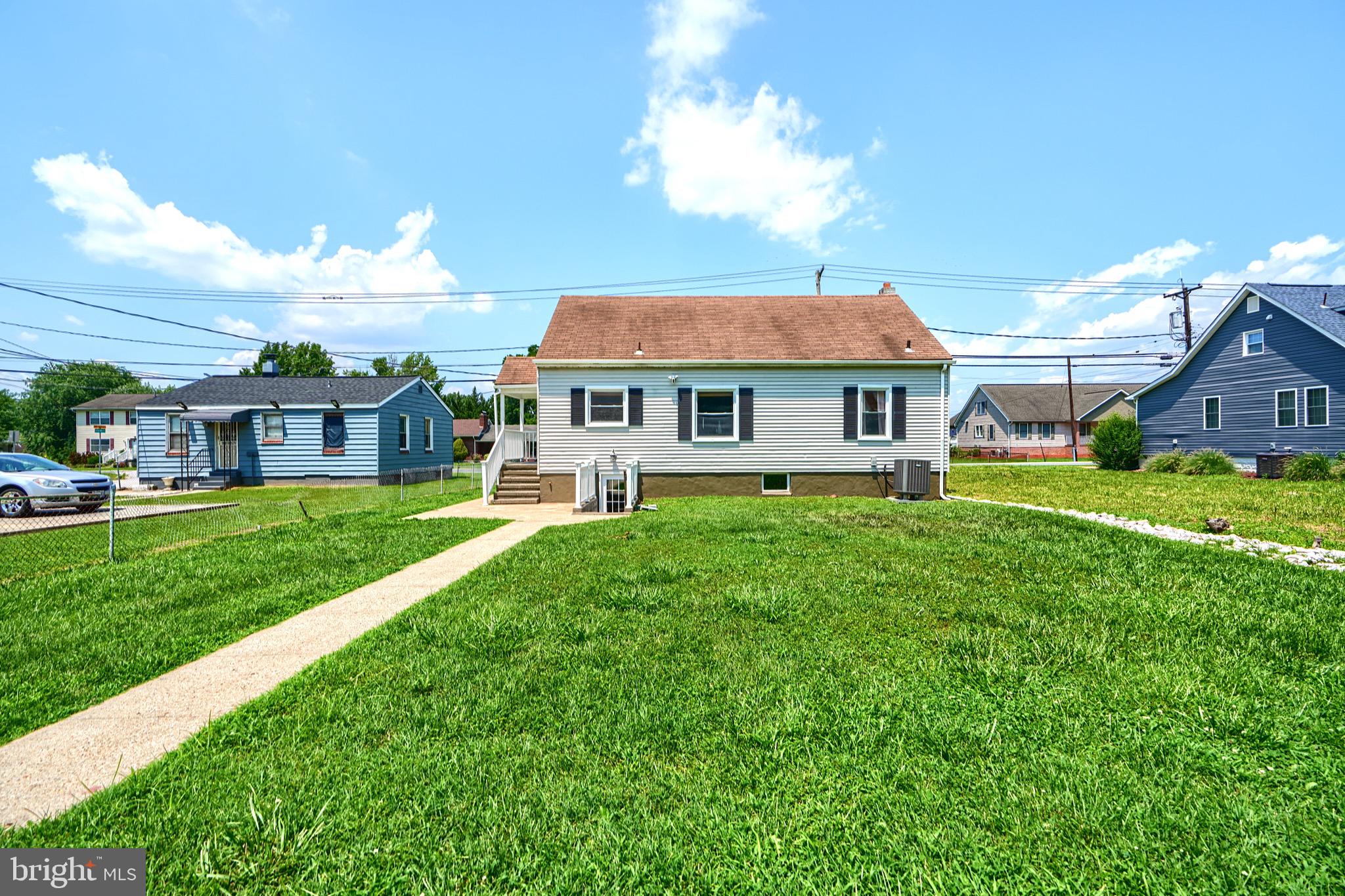 2903 Sparrows Point Road Sparrows Point, MD 21219 - Photo 55 of 57 a front view of a house with a yard table and chairs