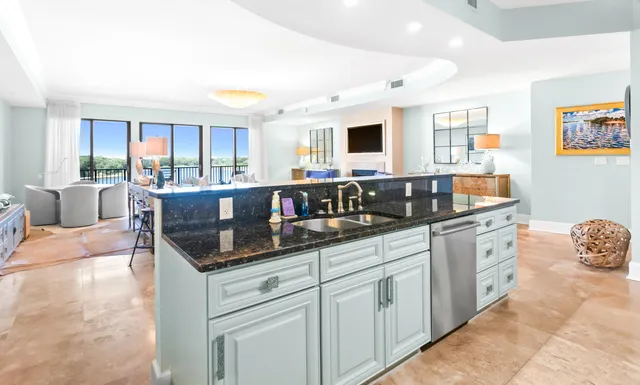 a bedroom with furniture and a large window