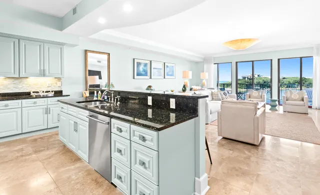 a bedroom with a bed a flat screen tv and a couch