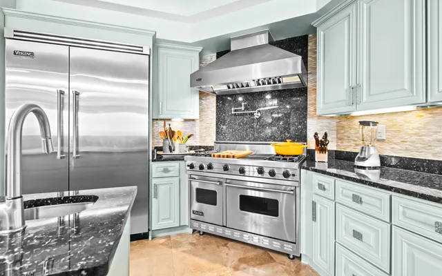 a bedroom with furniture and a chandelier