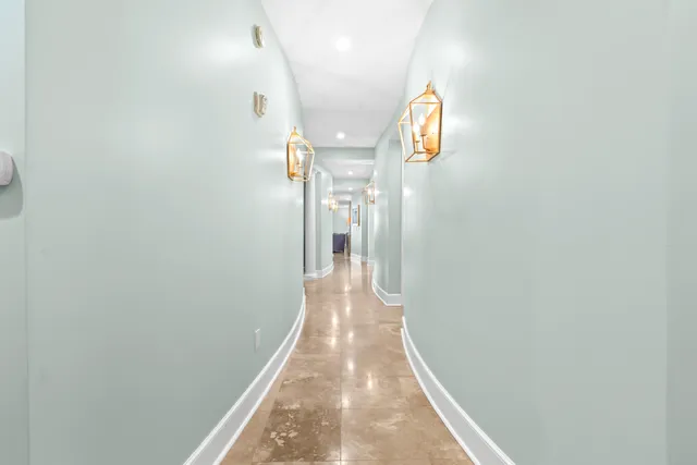 a living room with furniture a flat screen tv and a window