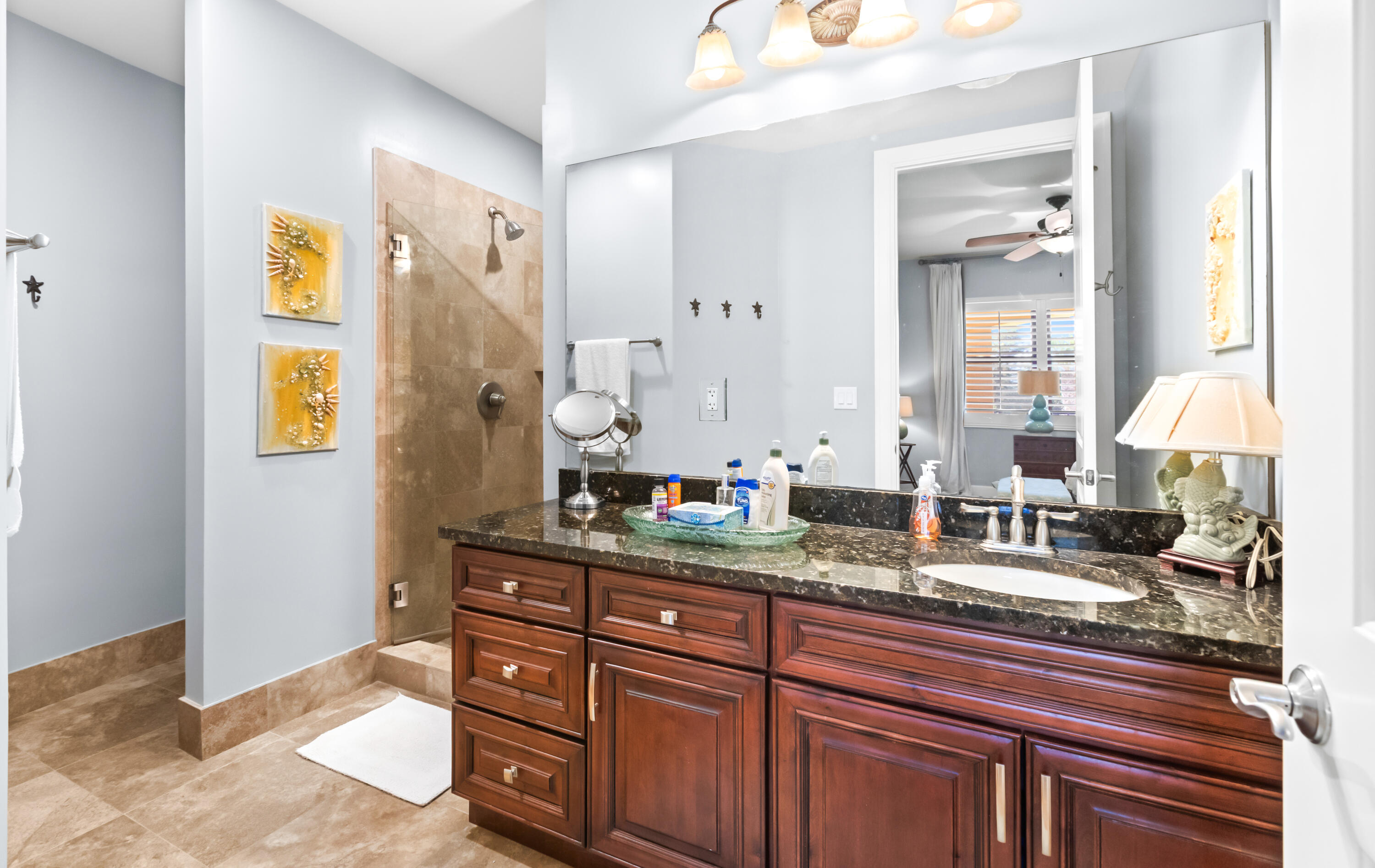 1363 West County Highway 30A, Unit 2120 Santa Rosa Beach, FL 32459 - Photo 46 of 107 a bathroom with a granite countertop sink and a mirror