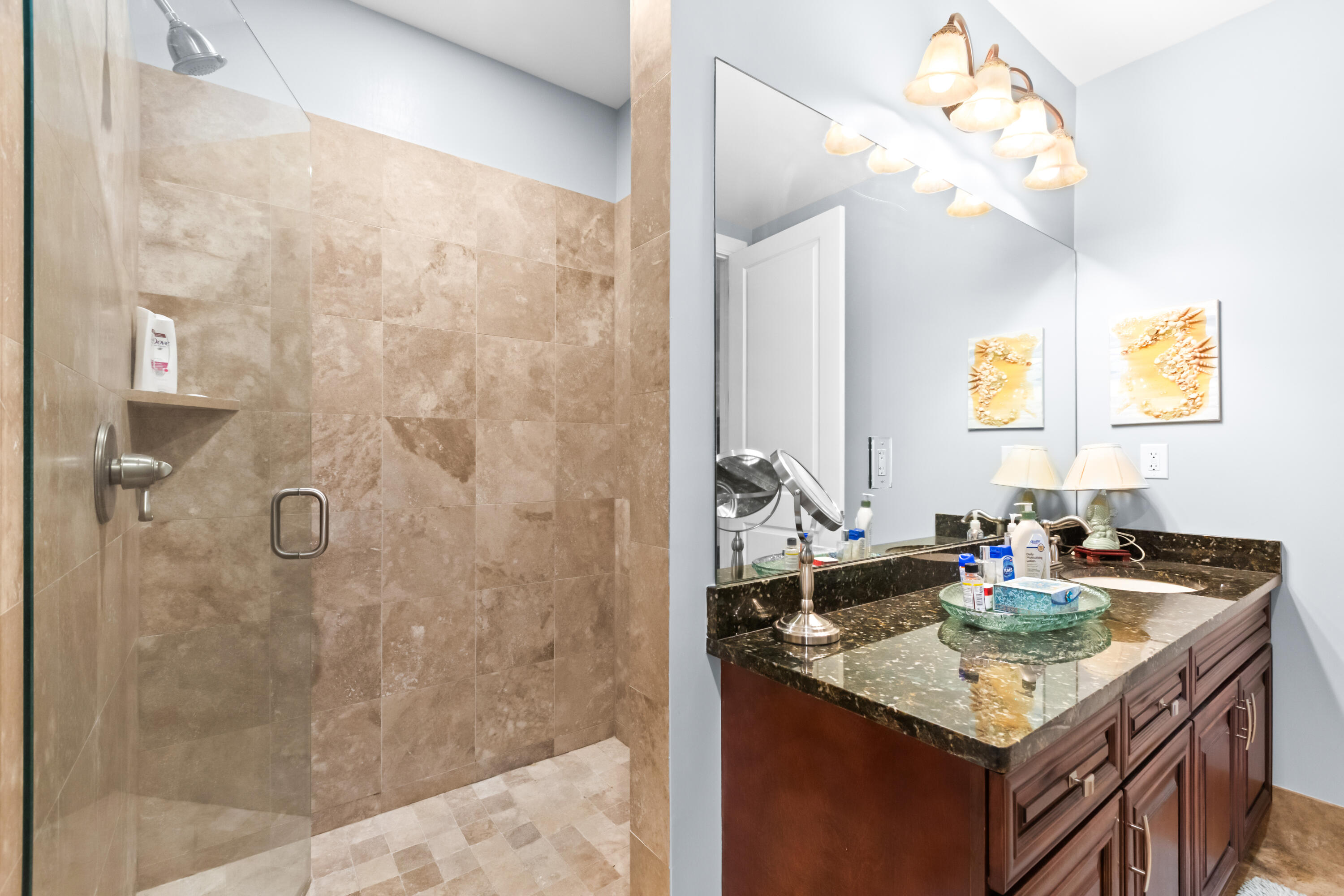 1363 West County Highway 30A, Unit 2120 Santa Rosa Beach, FL 32459 - Photo 47 of 107 a bathroom with a granite countertop sink a mirror a vanity and shower