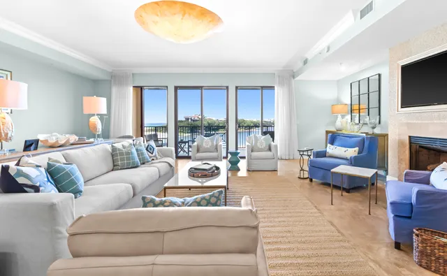 a living room with furniture fireplace and a flat screen tv