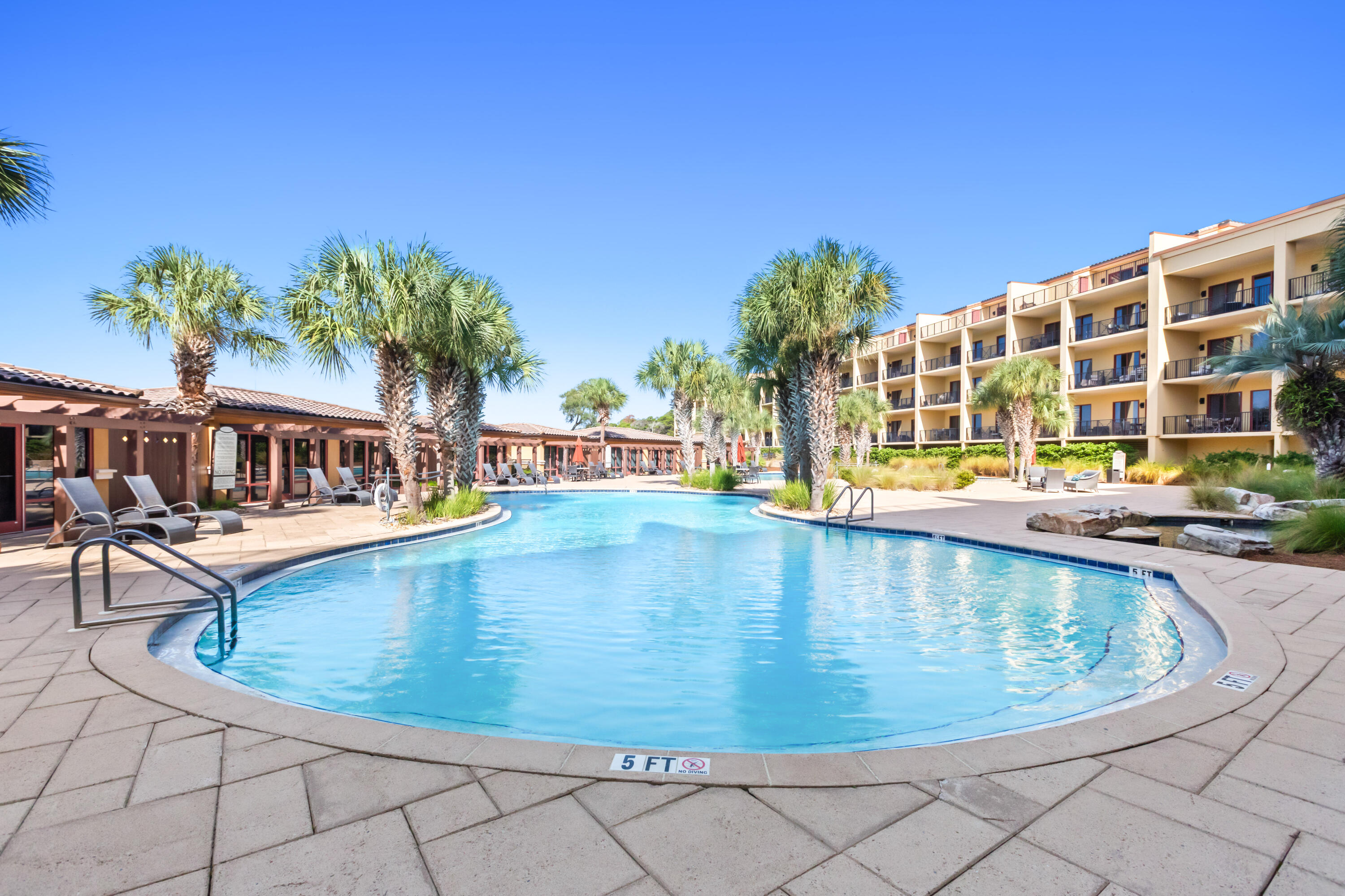 1363 West County Highway 30A, Unit 2120 Santa Rosa Beach, FL 32459 - Photo 79 of 107 a view of a swimming pool with a lounge chair