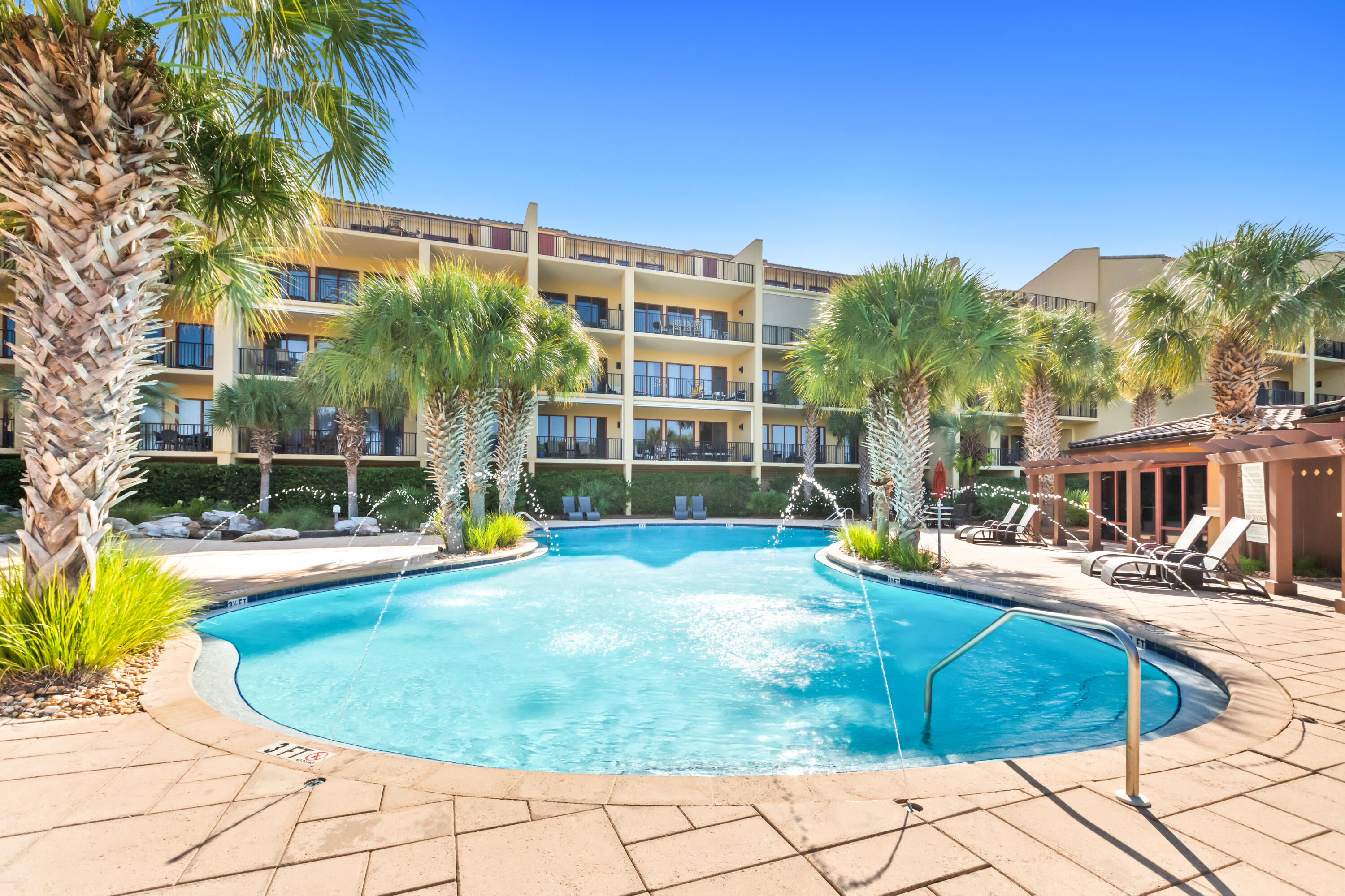 1363 West County Highway 30A, Unit 2120 Santa Rosa Beach, FL 32459 - Photo 80 of 107 a view of a swimming pool with a lounge chair