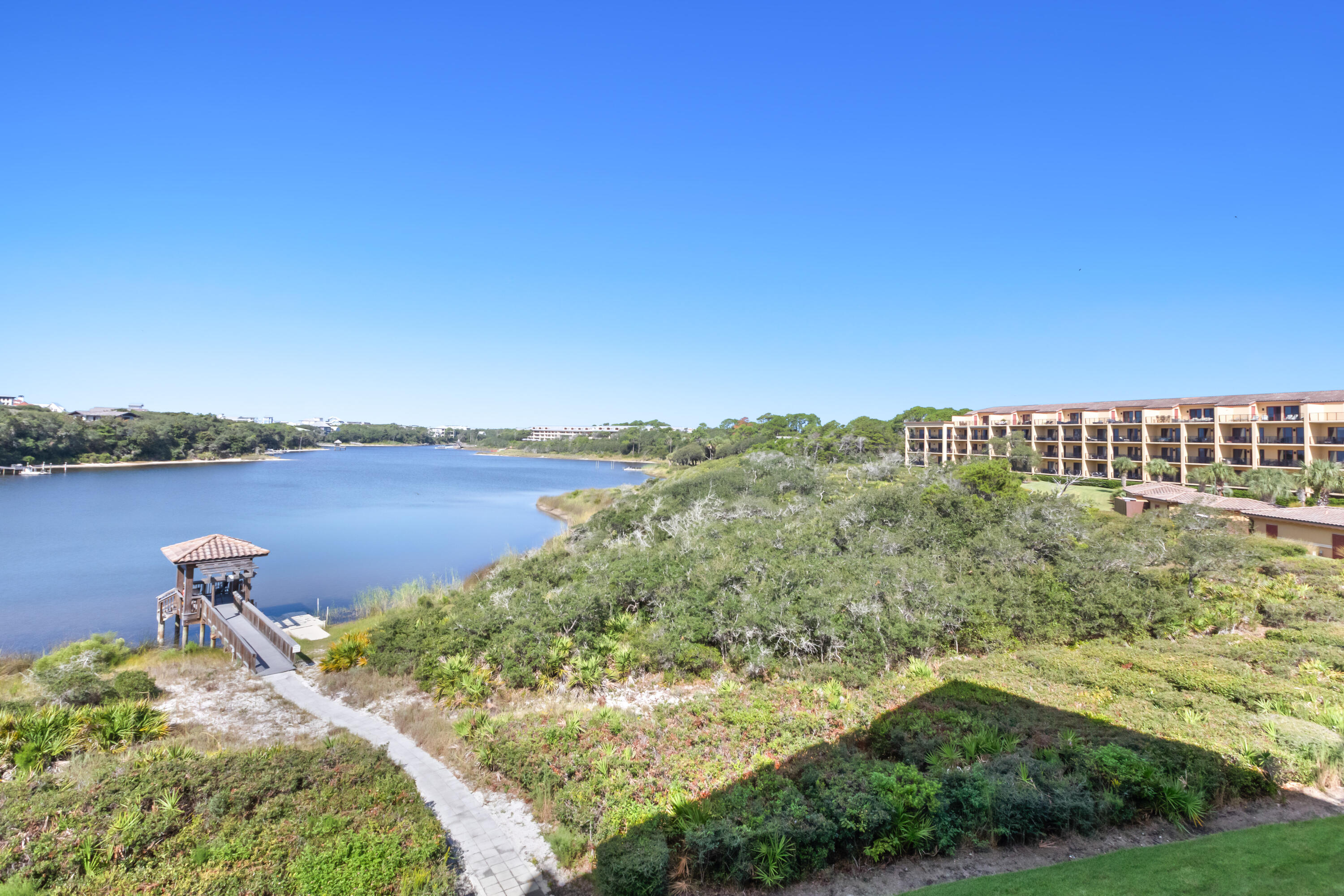 1363 West County Highway 30A, Unit 2120 Santa Rosa Beach, FL 32459 - Photo 94 of 107 a view of a lake with houses in the back