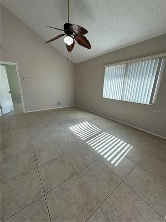 a view of an empty room with windows