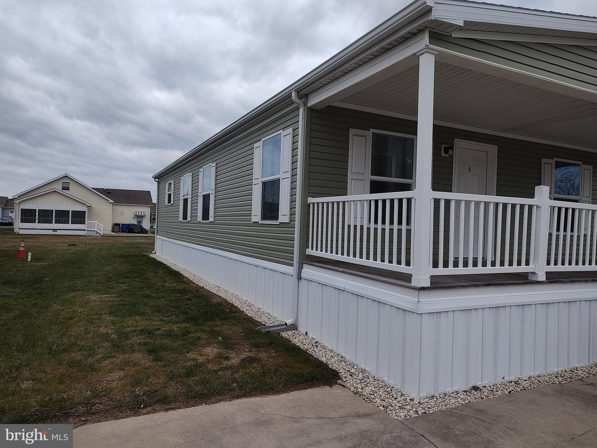 3 Nottingham Drive Lewes, DE 19958 - Photo 2 of 26 a front view of a house with a yard