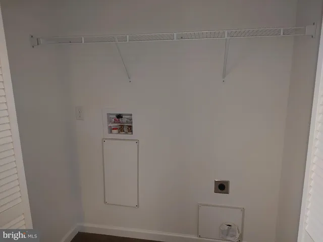 a view of storage and utility room with closet