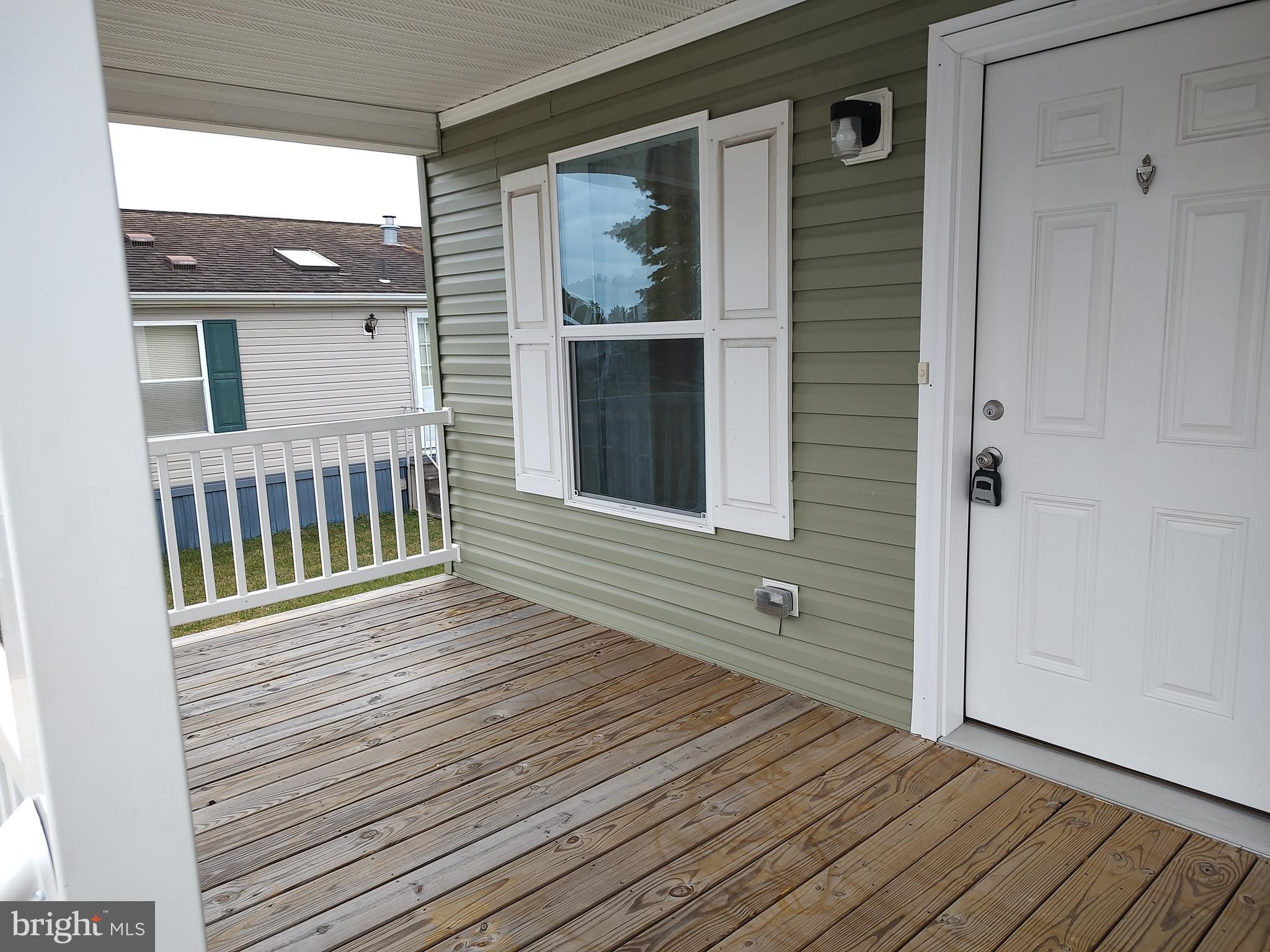 3 Nottingham Drive Lewes, DE 19958 - Photo 5 of 26 a view of a house with wooden deck