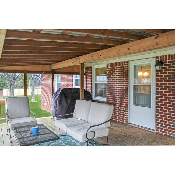 847 Lockmiller Road Winchester, TN 37398 - Photo 22 of 29 a living room with furniture and a floor to ceiling window
