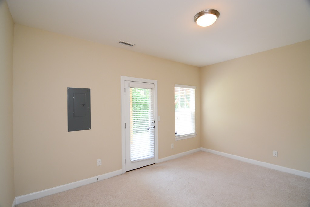 8717 Cypress Grove Run Raleigh, NC 27612 - Photo 21 of 25 great flex room with private entrance and half bath. Could be office, den, bedroom, playroom, etc. Man Cave? Craft room? lower level bonus room