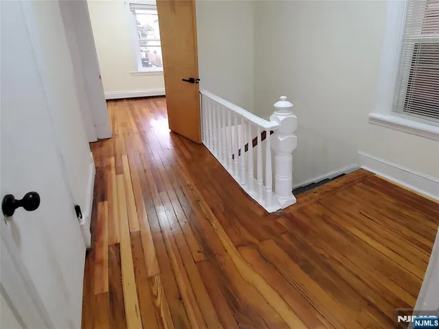 a kitchen with a stove a sink and a window