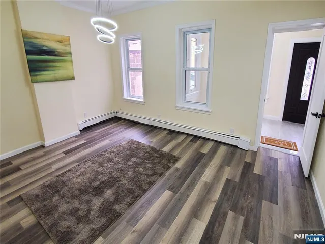 a kitchen with a stove a sink a refrigerator and cabinets