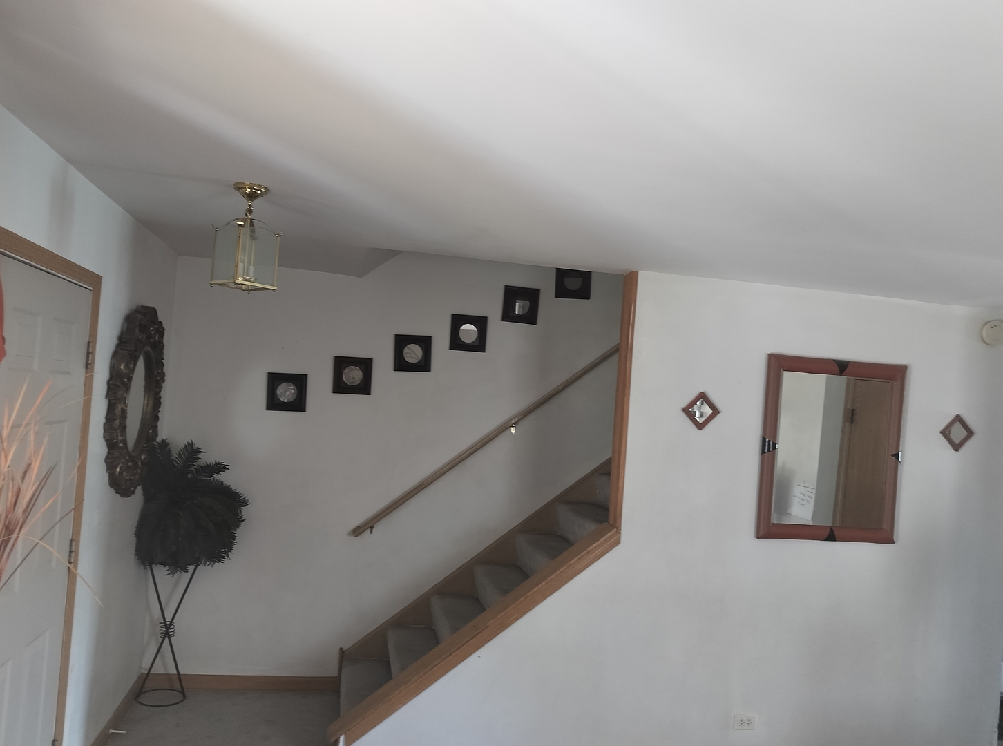 528 Alcott Lane Bolingbrook, IL 60440 - Photo 5 of 15 a view of a livingroom with wooden floor and a ceiling fan
