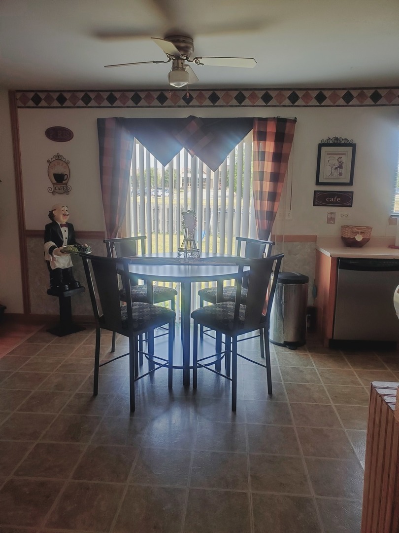 528 Alcott Lane Bolingbrook, IL 60440 - Photo 7 of 15 a dining room with furniture and window