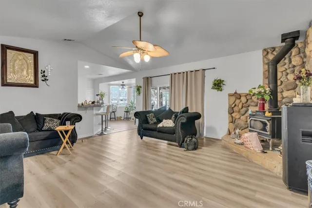 a living room with furniture window and wooden floor