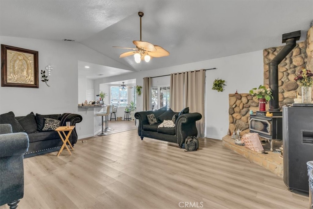 12008 Sierra Vista Road Phelan, CA 92371 - Photo 14 of 29 a living room with furniture window and wooden floor