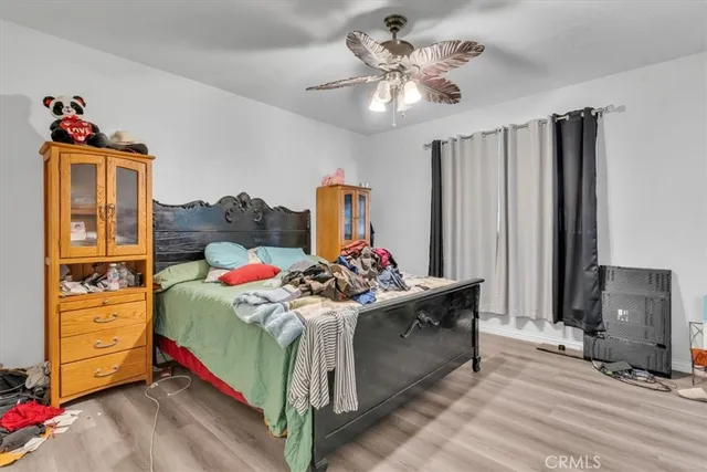 a bed room with a bed and a chandelier