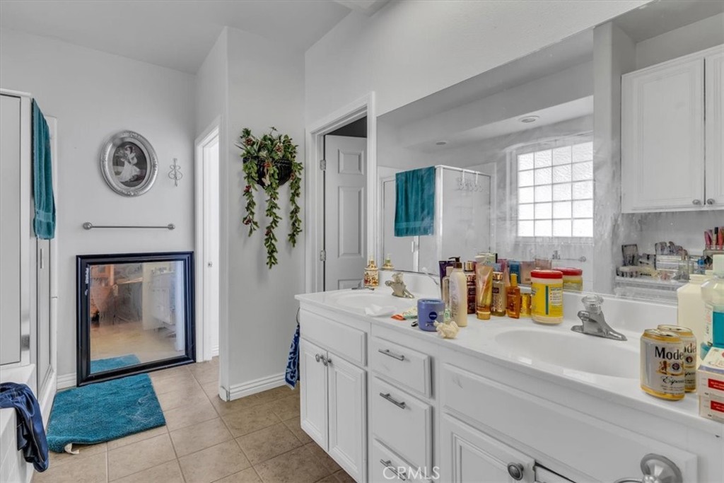 12008 Sierra Vista Road Phelan, CA 92371 - Photo 16 of 29 a kitchen with a refrigerator and a stove