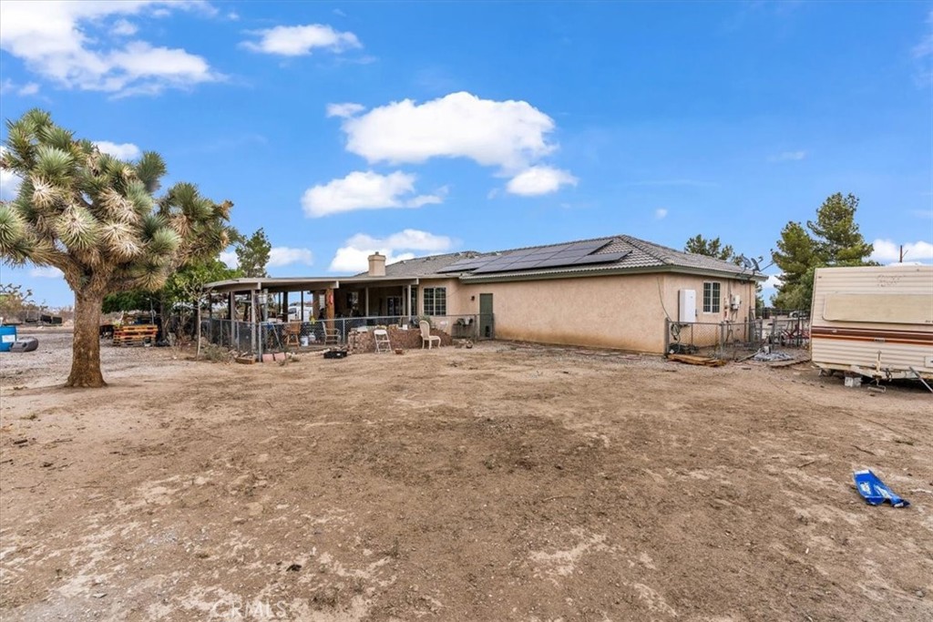12008 Sierra Vista Road Phelan, CA 92371 - Photo 24 of 29 a front view of a house with a yard