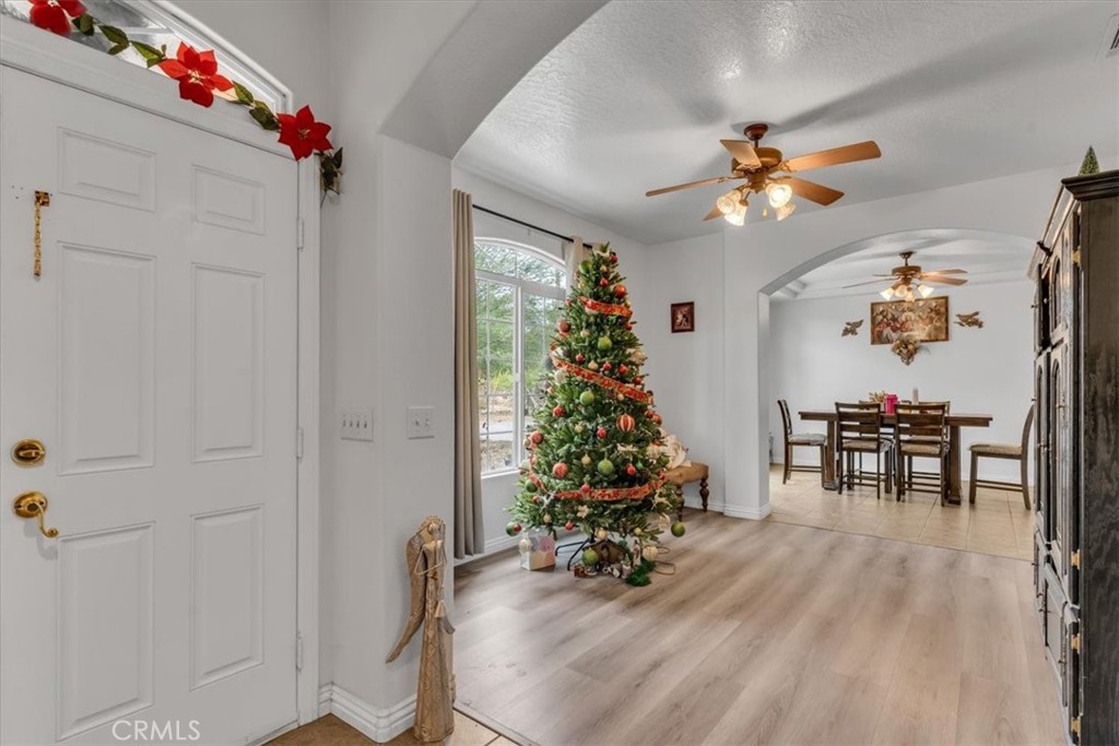 12008 Sierra Vista Road Phelan, CA 92371 - Photo 6 of 29 a view of a dining room with furniture and chandelier
