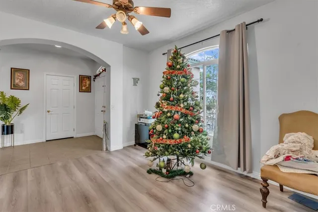 a room with flowers and a chandelier