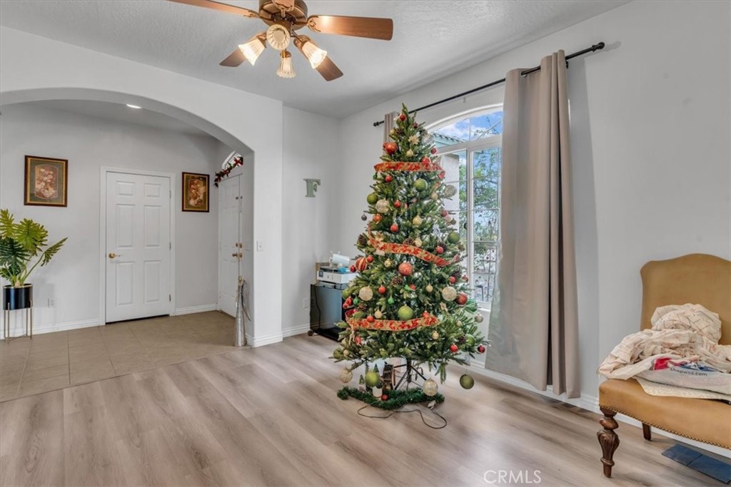 12008 Sierra Vista Road Phelan, CA 92371 - Photo 7 of 29 a room with flowers and a chandelier