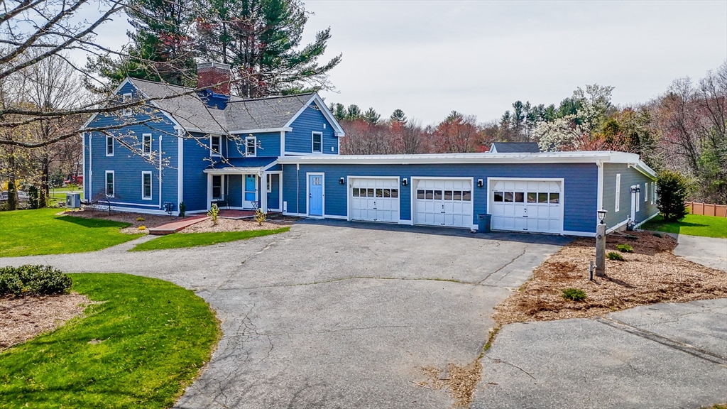 75 Concord Road Chelmsford, MA 01824 - Photo 1 of 42 front view of a house with a yard