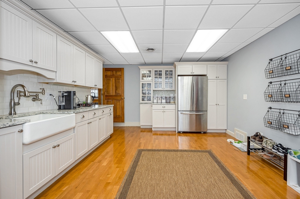 75 Concord Road Chelmsford, MA 01824 - Photo 3 of 42 a kitchen with stainless steel appliances a refrigerator sink and cabinets