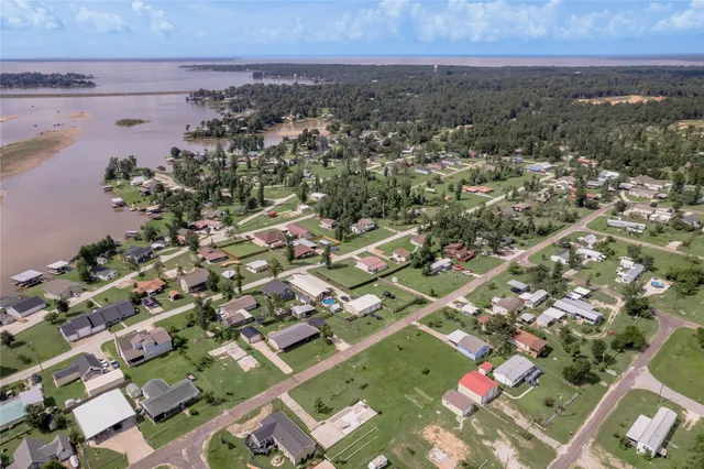 an aerial view of a city with lake view