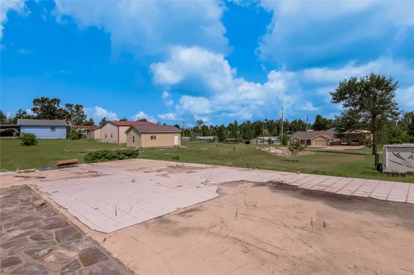 a view of a house with a big yard