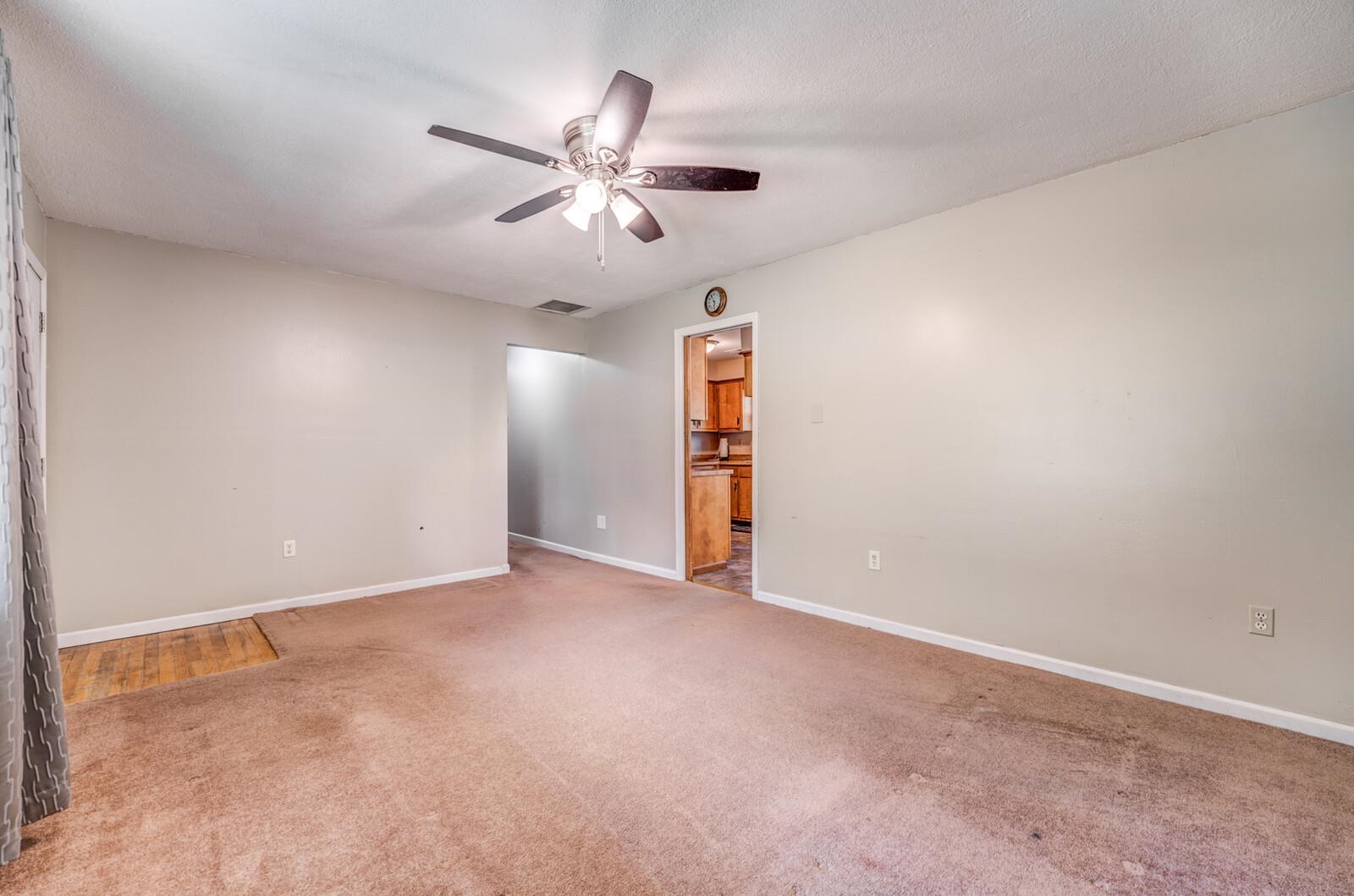 6125 Warren Road Oakland, TN 38060 - Photo 10 of 40 Spacious room with a ceiling fan, light-toned walls, and carpet flooring