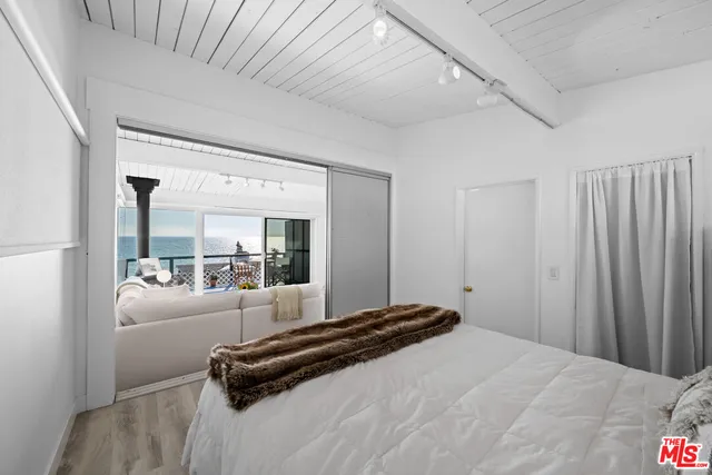 a view of a city street with cars