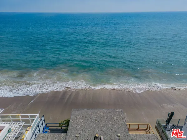 a view of an ocean and a building
