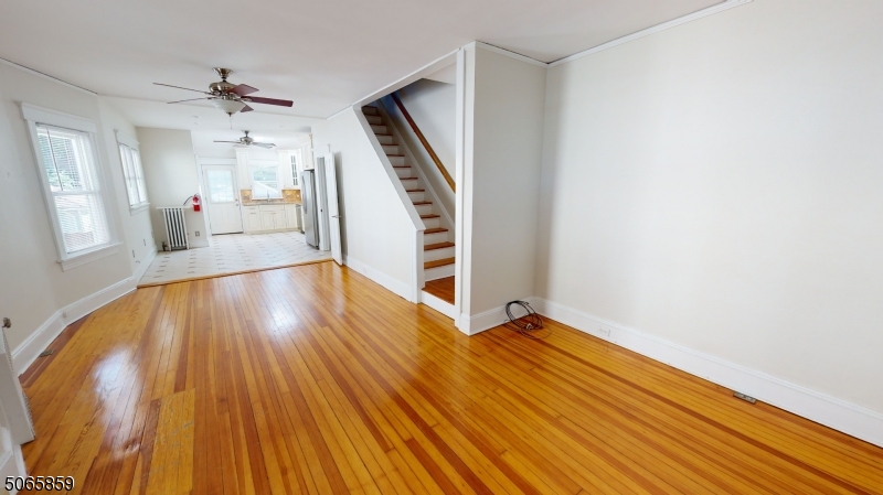 40-42 Dunnell Road Maplewood, NJ 07040 - Photo 7 of 18 wooden floor in an empty room with a window