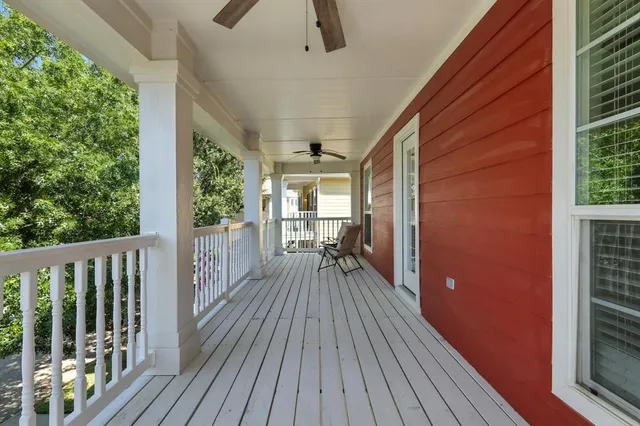 a view of balcony with wooden floor