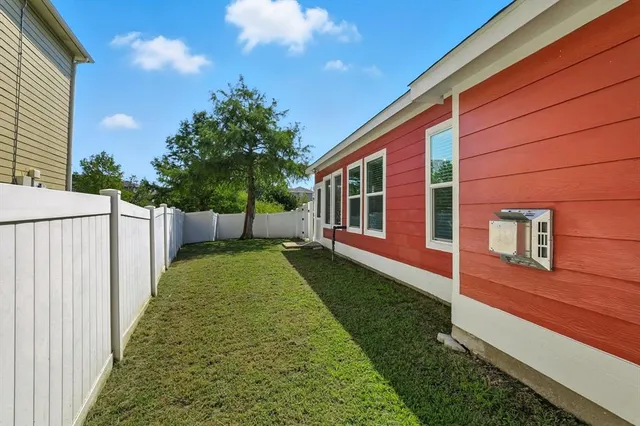 a view of house with backyard
