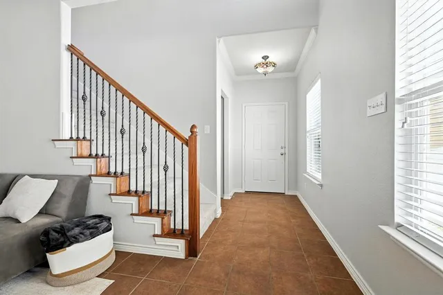 a view of a livingroom with furniture and stairs