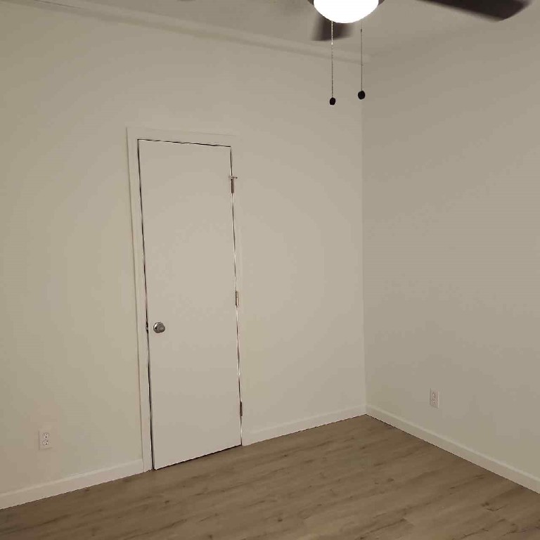 85008 Loretta Lane Yulee, FL 32097 - Photo 16 of 30 a view of an empty room with wooden floor