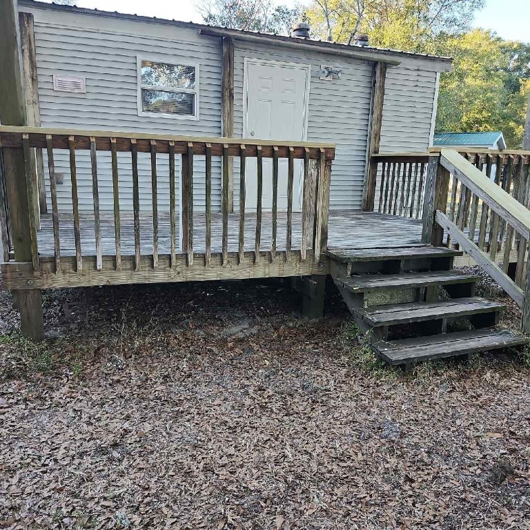 85008 Loretta Lane Yulee, FL 32097 - Photo 29 of 30 a view of a backyard with a garden