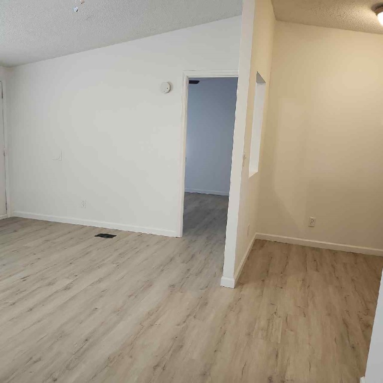 85008 Loretta Lane Yulee, FL 32097 - Photo 4 of 30 an empty room with wooden floor